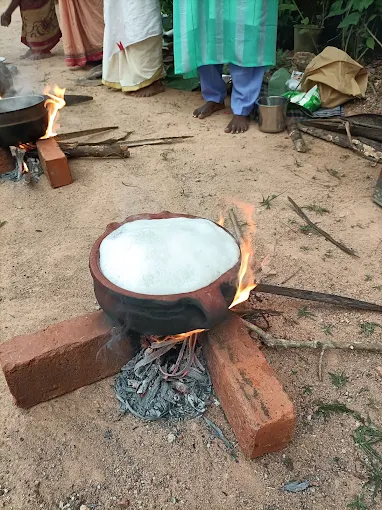 An offering cooking in a clay pot